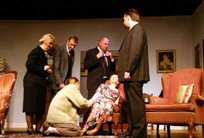 Ms. Harries being examined by the helpful house guests.