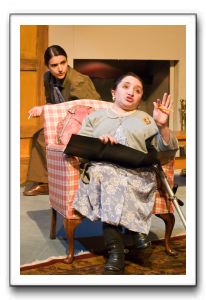 Suzanne Richard as Mrs. Boyle (foreground), spars with Abby Wood as Miss Casewell.