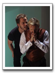 Hamlet (Graham Michael Hamilton) debates killing Claudius (David Whalen) while he prays.