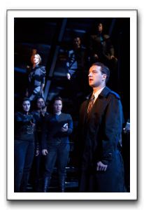 Euan Morton and the Ensemble with Jill Paice in the background