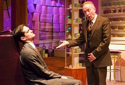 Joshua Dick, seated, as George, and Mario Baldessari as Mr. Sipos