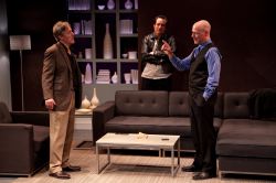 Michael Russotto (center, as Yvan) looks on as John Lescault (left, as Serge) and Mitchell Hébert (right, as Marc) go at it.