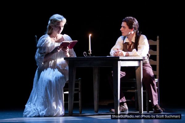 Katrina Van Tassel (Whitney Bashor) is introduced to a forbidden book from her new friend Ichabod Crane (Sam Ludwig)