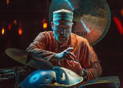 Musician Tom Teasley performs on traditional instruments