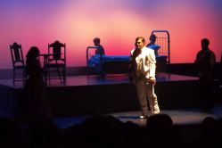 Sean Driggers and ensemble (in silhouette)
