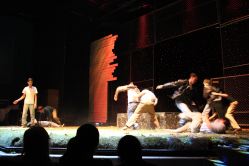 Daniel Walsh as Ponyboy and Tommy Gambon as Darry with company actors in the rumble scene