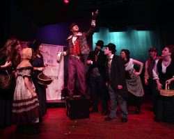 Ben Ribler (Toby) and Ensemble