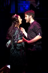 Natascia Diaz (as Anastasia) and Doug Kreeger (as Grigori Rasputin) make a connection