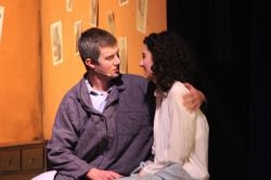 Otto Frank (Drew Holcombe) comforts his daughter Anne (Catherine Ariale) after a nightmare