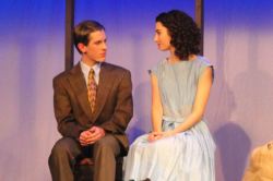 Peter Van Daan (William Shipley) and Anne Frank (Catherine Ariale) share an intimate moment up in the attic