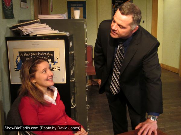 New theater intern Heidi Bishop (Emily Sucher) fends off the advances of business manager Mike Braschi (Chris Hawkins)