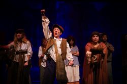 Gavroche (Ethan Van Slyke) and the beggars of Paris