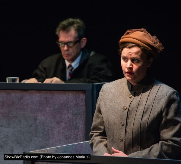 Mary Beth Luckenbaugh as Maria Wallner. Background: Tel Monks as Judge Ives.